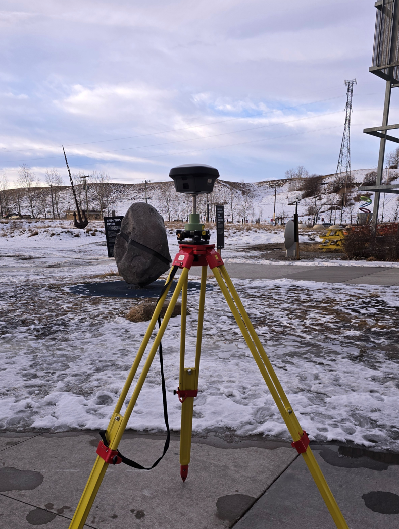 GNSS receiver on tripod outdoors establishing GPS control